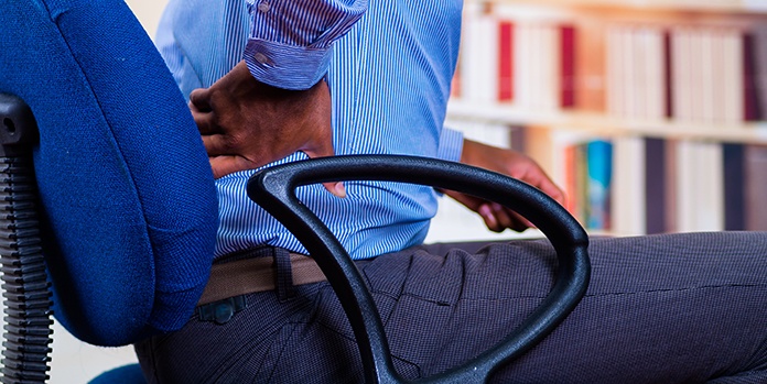 Man with Hip Back Pain in Office Chair