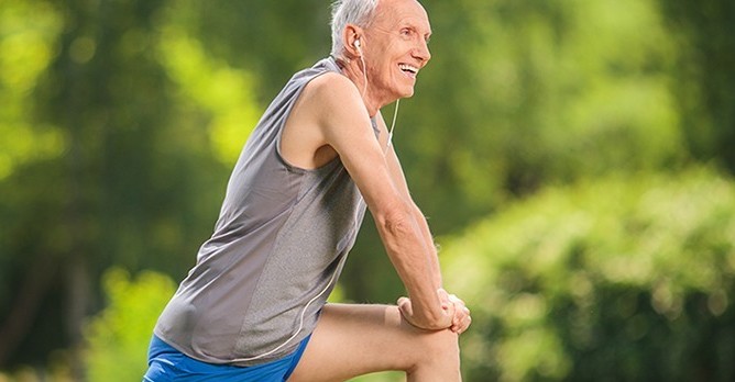 shutterstock_291732446 1040 400 Senior Man Stretching After Run Sun