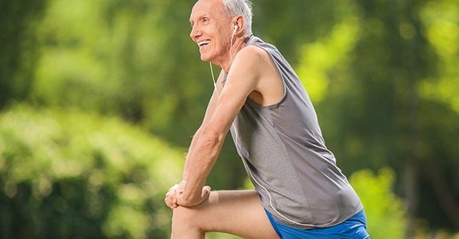 Senior Man Stretching After Run Sun