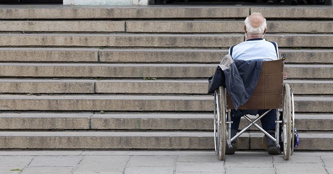 Senior Wheelchair Facing Stairs