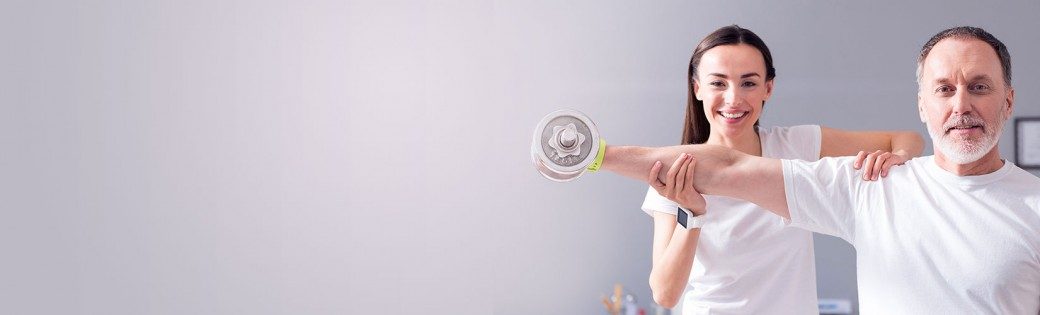 Kinesiologist measuring a client's shoulder range of motion.